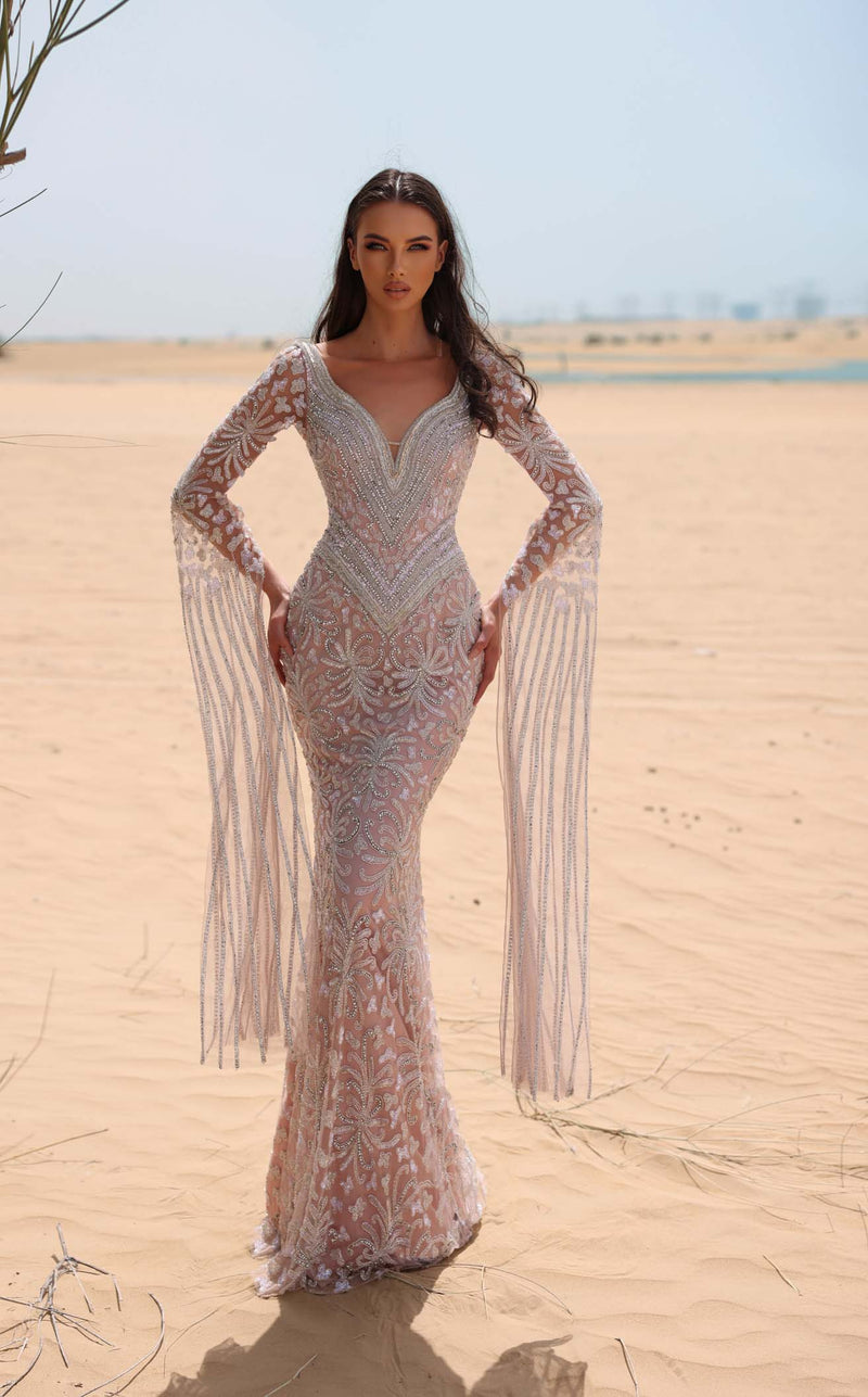 red carpet sand dress Tyla's sand-covered Met Gala 2024 gown was chopped in half after the red carpet